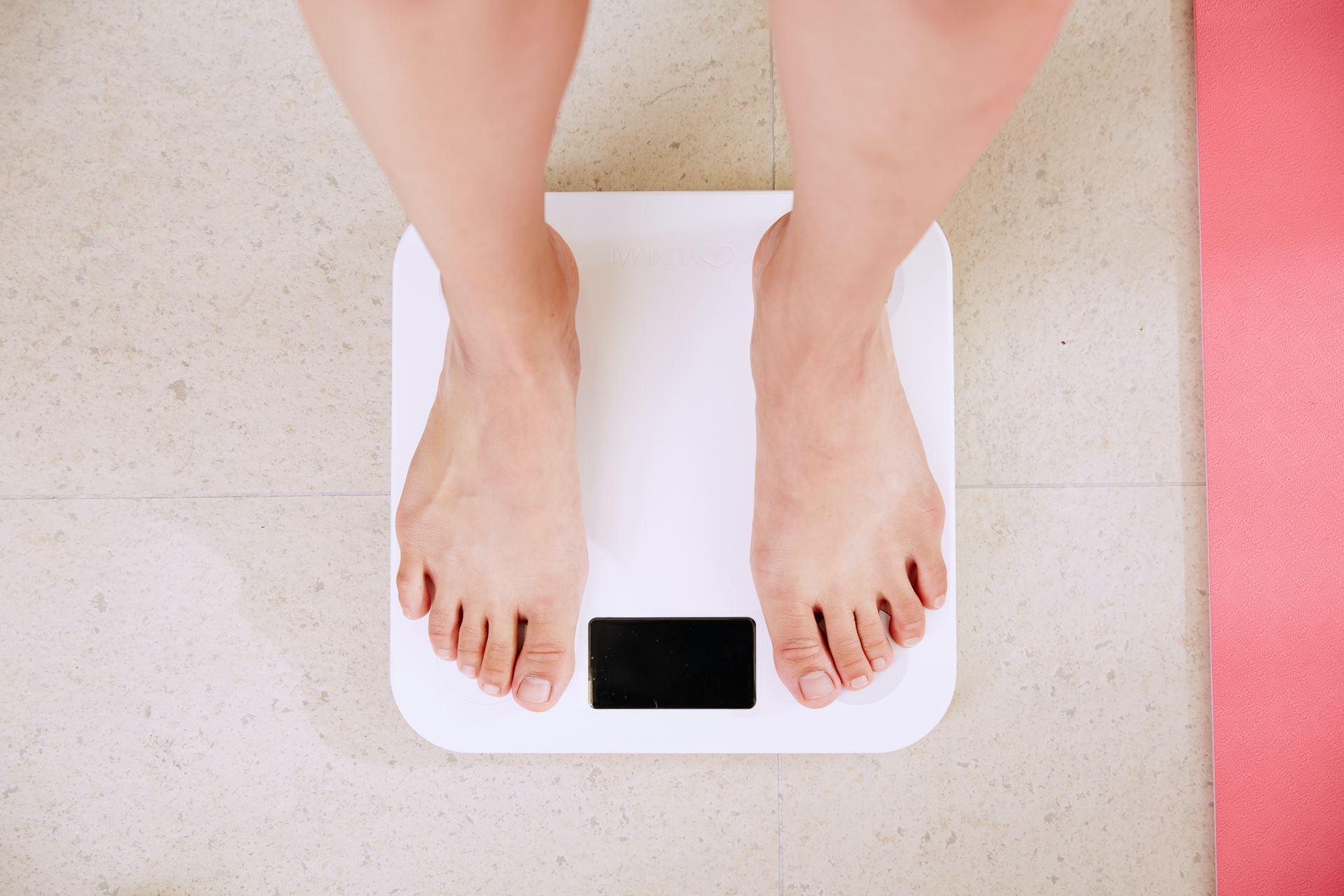 a person standing on some scales to weigh themselves