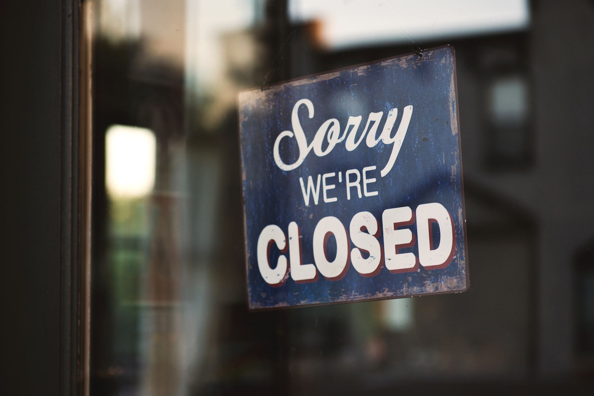 a sign saying 'sorry we're closed'