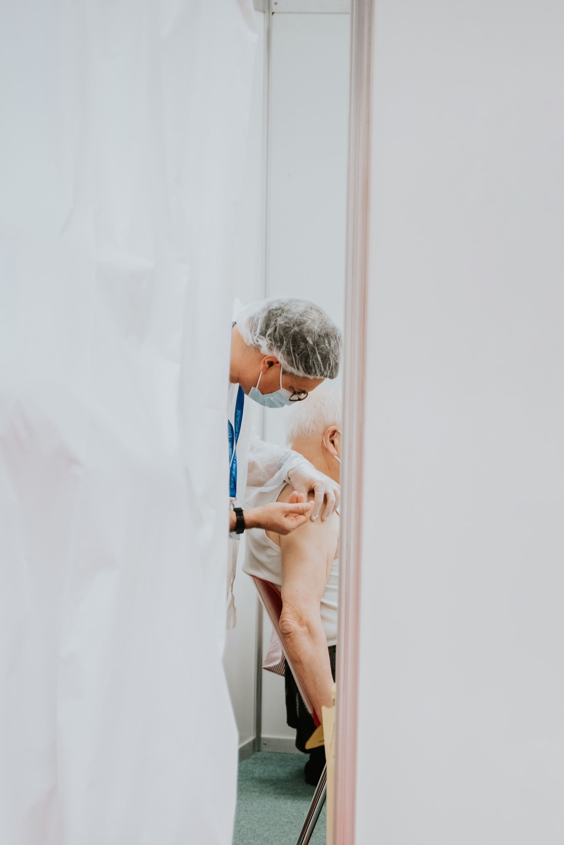 a doctor giving a patient an injection