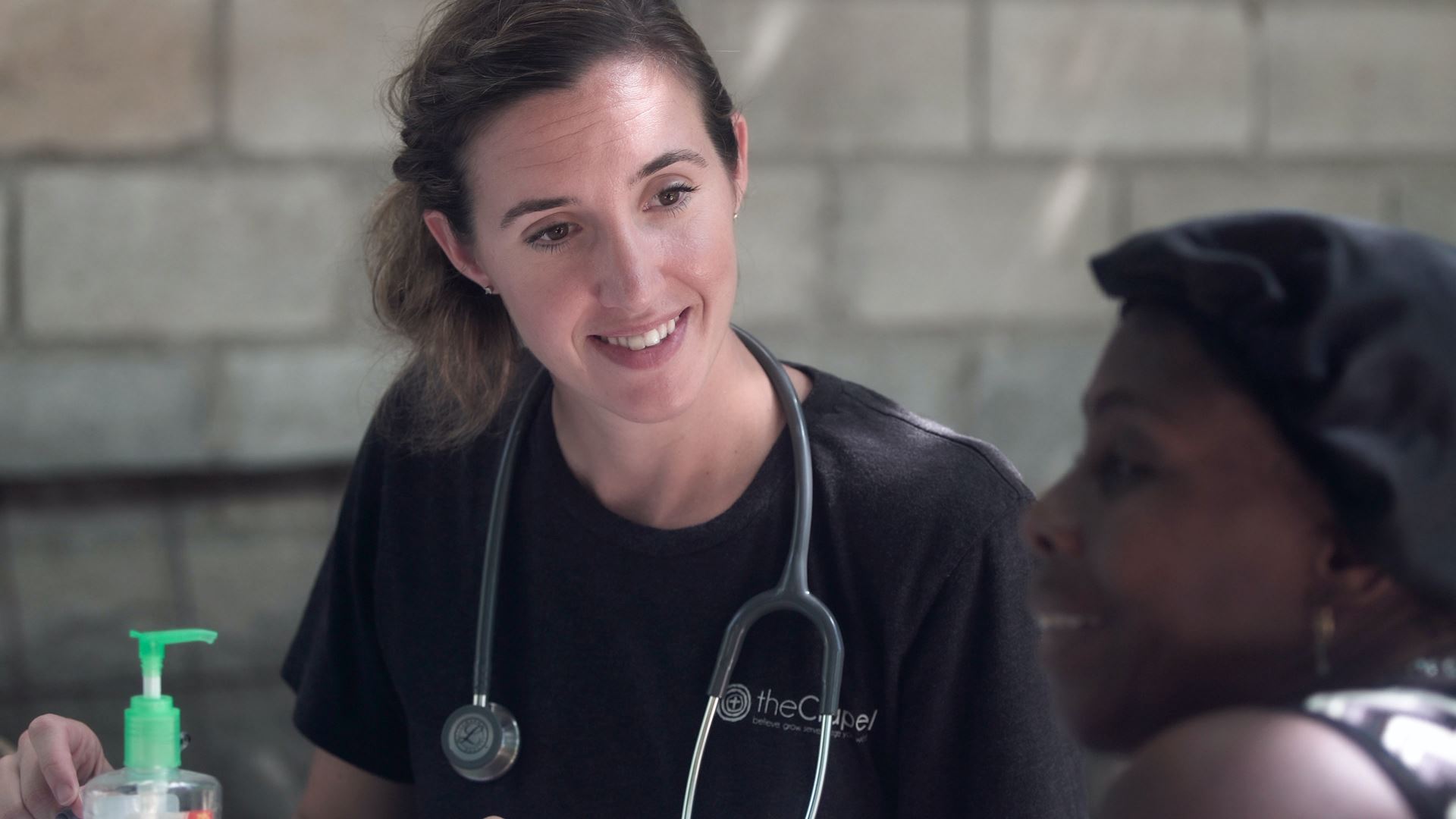 a nurse smiling at a patient