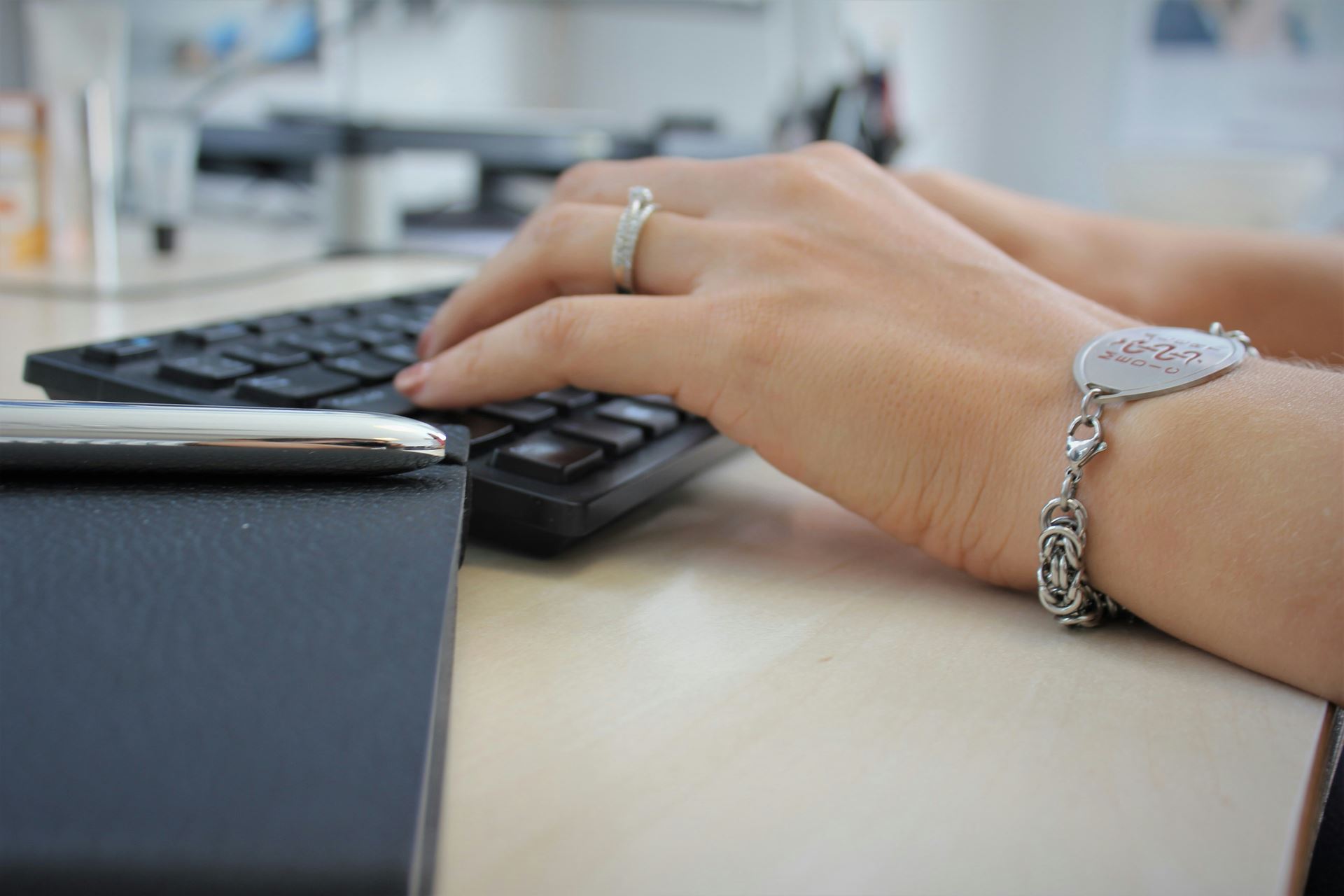 The hands of a person at a keyboard