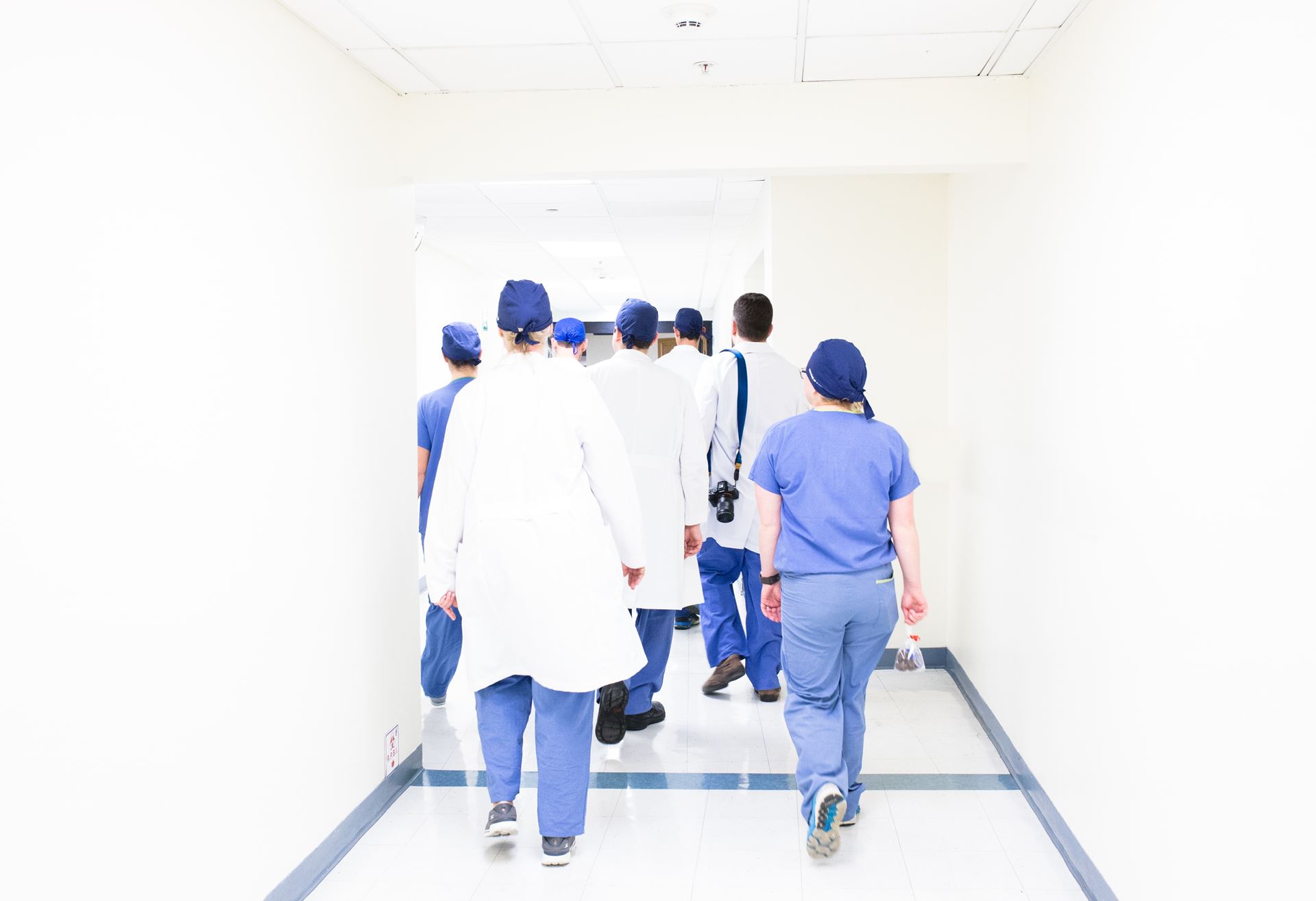 team of medical staff walking in a corridoor
