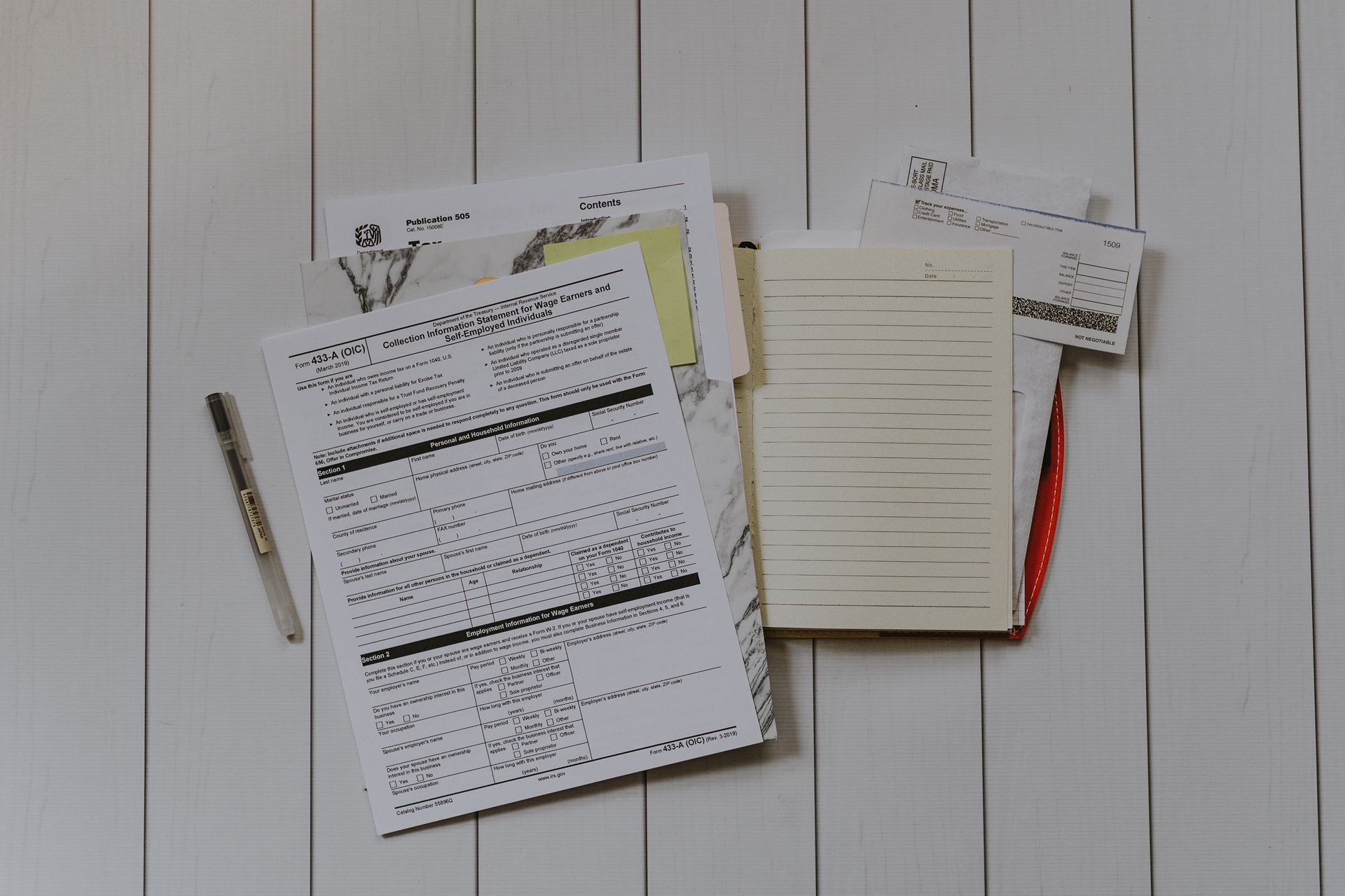 a selection of forms on a white table